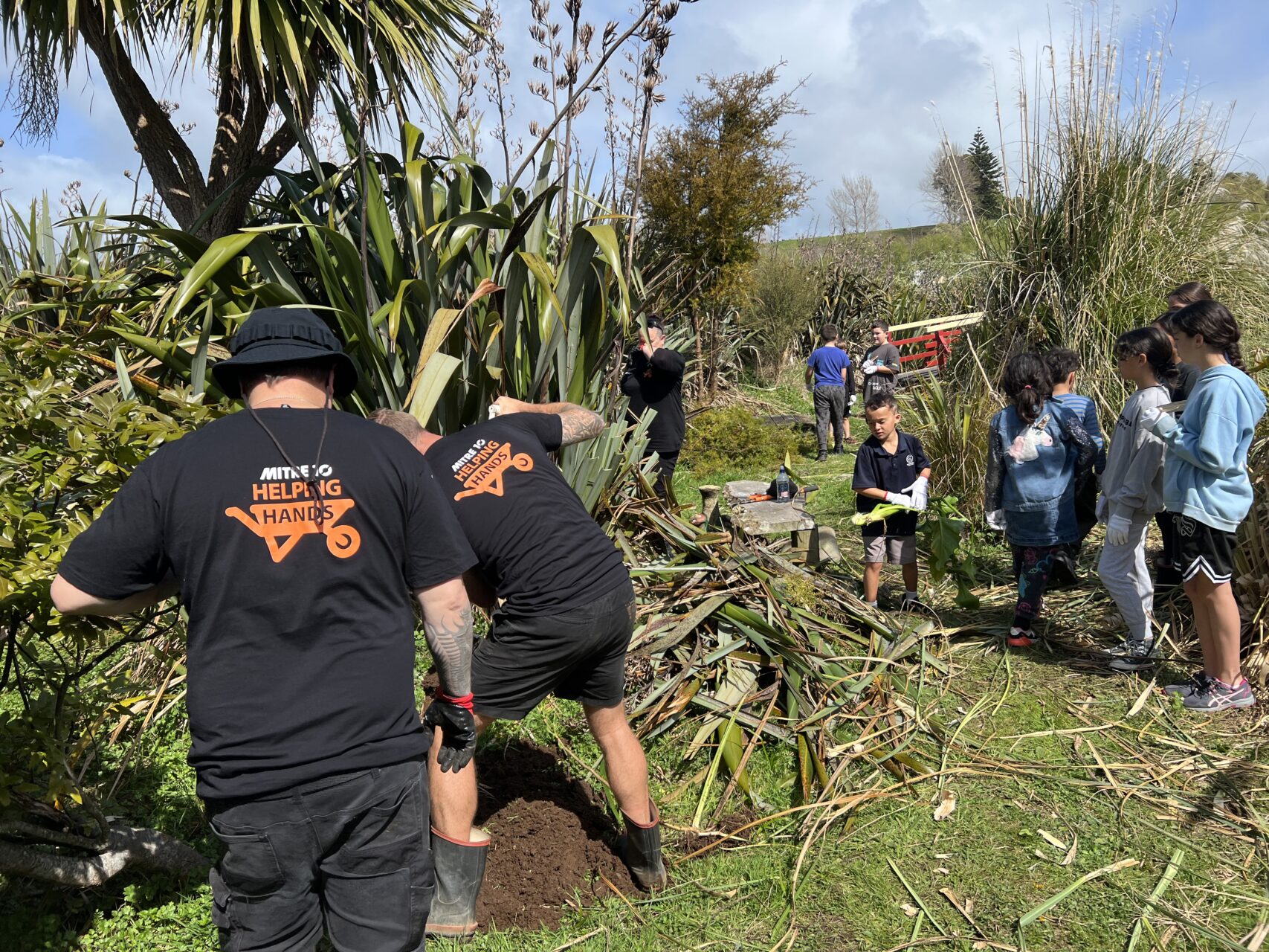 Enviroschools St Joseph’s Waitara get help weeding wetland
